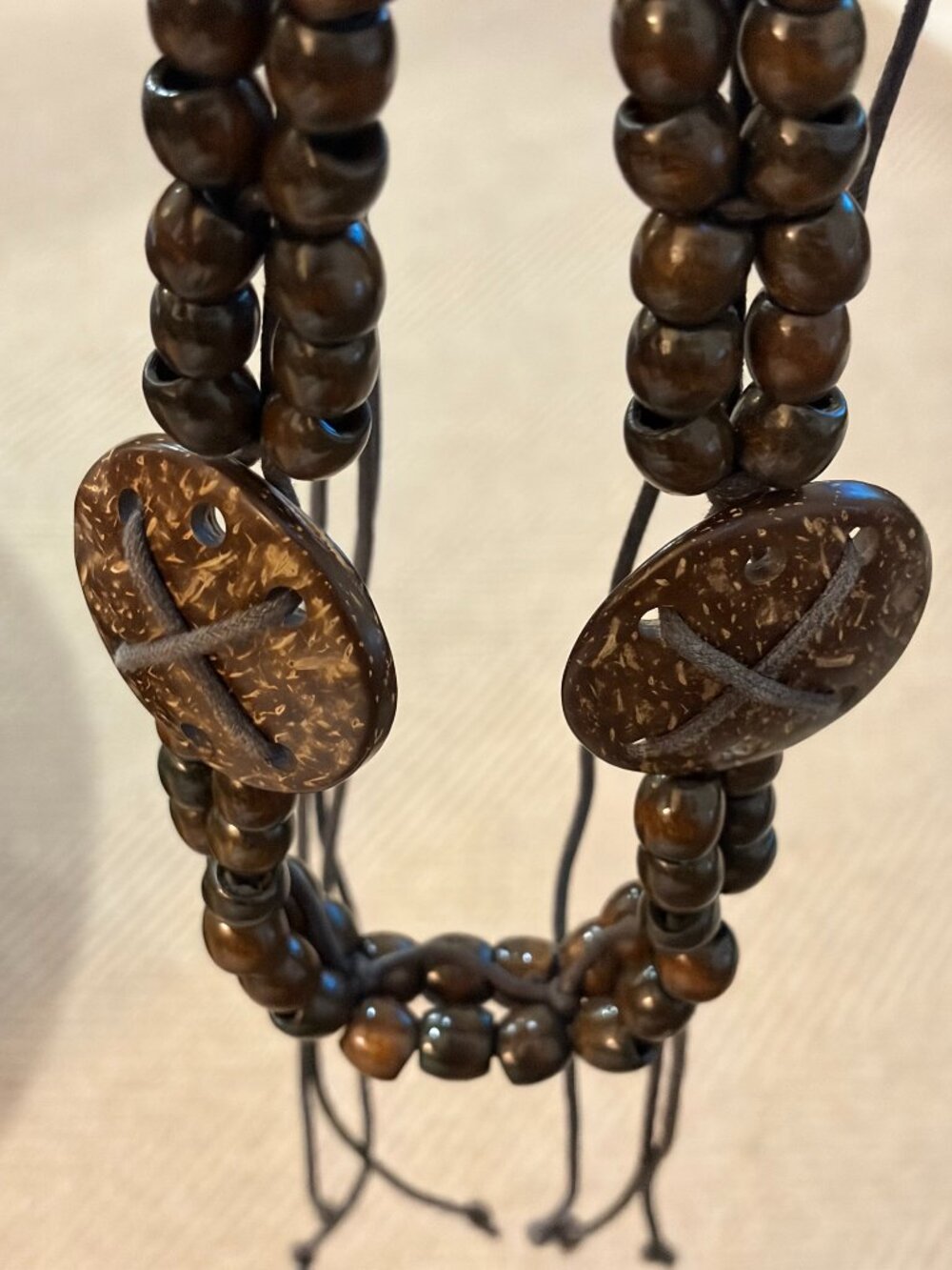 Boho style belt with dark wooden beads and decorative coconut shell disks